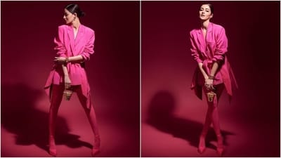 Ananya accessorised the ensemble with earrings, a bracelet, a Judith Leiber Khloé's Pot of Gold bag, rings, sheer hot pink stockings, and block high heels. Lastly, Ananya chose winged cat eyeliner, kohl-lined eyes, darkened brows, nude pink lips, mascara on the lashes, blushed cheeks, a dewy base, and a side-parted sleek bun. (Instagram) Ananya accessorised the ensemble with earrings, a bracelet, a Judith Leiber Khloé's Pot of Gold bag, rings, sheer hot pink stockings, and block high heels. Lastly, Ananya chose winged cat eyeliner, kohl-lined eyes, darkened brows, nude pink lips, mascara on the lashes, blushed cheeks, a dewy base, and a side-parted sleek bun. (Instagram)