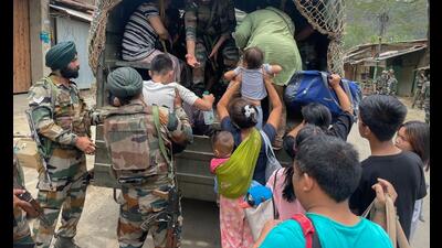 Army personnel rescue people from a violence-hit area of Manipur, May 6, 2023 (PTI) Army personnel rescue people from a violence-hit area of Manipur, May 6, 2023 (PTI)