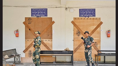 BSF personnel guard a sealed room where electronic voting machines (EVMs) are stored in Bengaluru. (AFP) BSF personnel guard a sealed room where electronic voting machines (EVMs) are stored in Bengaluru. (AFP)