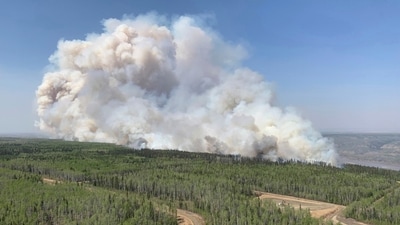 A wildfire burns a section of forest in the Grande Prairie district of Alberta, Canada, Saturday, May 6, 2023. (Government of Alberta Fire Service/The Canadian Press via AP) (AP) A wildfire burns a section of forest in the Grande Prairie district of Alberta, Canada, Saturday, May 6, 2023. (Government of Alberta Fire Service/The Canadian Press via AP) (AP)