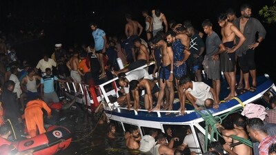 People carry out rescue operations at the site of a boat accident in Tanur, in Malappuram district of India's Kerala state (AFP) People carry out rescue operations at the site of a boat accident in Tanur, in Malappuram district of India's Kerala state (AFP)