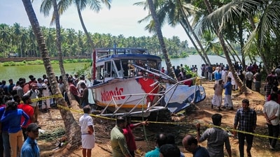 Onlookers gather near the site of a boat accident in Tanur, in Malappuram district on May 8, 2023. (AFP) Onlookers gather near the site of a boat accident in Tanur, in Malappuram district on May 8, 2023. (AFP)