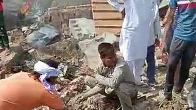 Local residents gather at the site of the IAF's MiG-21 fighter aircraft crash in Rajasthan on Monday. (ANI) Local residents gather at the site of the IAF's MiG-21 fighter aircraft crash in Rajasthan on Monday. (ANI)
