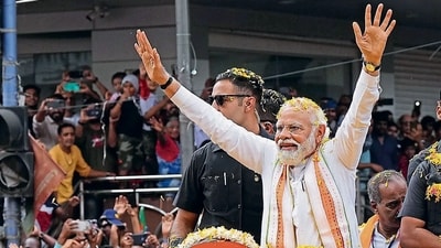 Prime Minister Narendra Modi during a roadshow in Bengaluru. (PTI) Prime Minister Narendra Modi during a roadshow in Bengaluru. (PTI)