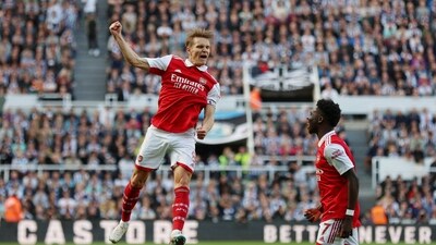 Arsenal's Martin Odegaard celebrates scoring their first goal with Bukayo Saka (Action Images via Reuters)