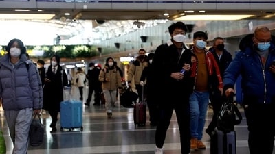 Travellers walk with their luggage at an airport (For representation). (Reuters) Travellers walk with their luggage at an airport (For representation). (Reuters)