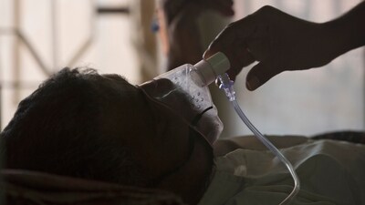 A patient affected by tuberculosis struggling to breathe. (AP)