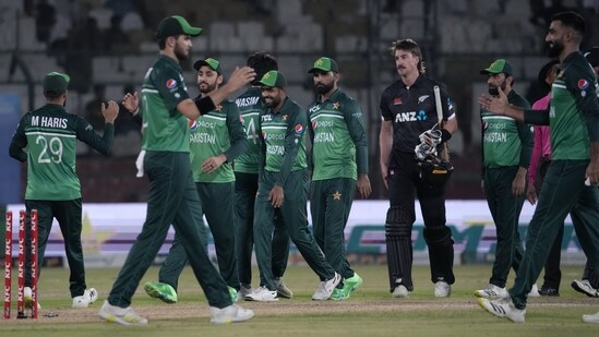 Pakistan's Babar Azam, center, and teammates congratulate each others (AP)