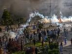 Police fire teargas shell towards Pakistan Tehreek-e-Insaf party activists and supporters of former Pakistan's Prime Minister Imran to dispers them during a protest against the arrest of their leader in Peshawar on Tuesday