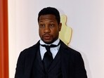 Jonathan Majors attends the champagne-colored red carpet during the Oscars arrivals at the 95th Academy Awards in Hollywood, Los Angeles, California, U.S.,
