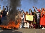 Imran Khan supporters chant slogans next to burning tires during a protest to condemn the arrest of their leader, in Hyderabad, Pakistan. 