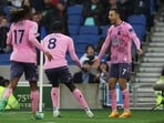 Everton's Dwight McNeil celebrates scoring their fifth goal with Alex Iwobi and Amadou Onana