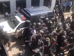 Ex-Pak PM Imran Khan being taken away by a horde of security personnel outside the Islamabad High Court. (Source: PTI/Twitter) 