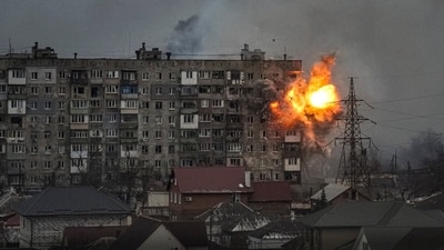 An explosion erupts from an apartment building at 110 Mytropolytska Street, after a Russian army tank fired on it in Mariupol, Ukraine, on March 11, 2022.&nbsp;The AP coverage of Mariupol, according to the Ukrainian city’s deputy mayor, focused the world’s attention on the devastation there and ultimately pressured Russians to open an evacuation route, saving thousands of civilian lives. (Evgeniy Maloletka / AP)