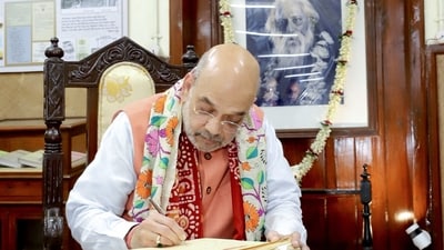Union home minister Amit Shah signs the visitor's book during his visit to Rabindranath Tagore's birthplace Jorasanko Thakurbari on the latter's birth anniversary in Kolkata on Tuesday. (Amit Shah twitter) Union home minister Amit Shah signs the visitor's book during his visit to Rabindranath Tagore's birthplace Jorasanko Thakurbari on the latter's birth anniversary in Kolkata on Tuesday. (Amit Shah twitter)