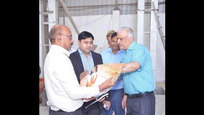 Additional chief secretary, department of agriculture, Devesh Chaturvedi, at the Nirala Herbal seed production unit, to hand over the first inventory of flour produced by the company to be sold on Flipkart. (HT Photo)