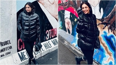 The last photoshoot shows Malaika dressed in a black hooded jacket, matching tights and a high-neck jumper. She styled the outfit with a top handle bag, boots, a messy hairdo, and a no-makeup look. (Instagram) The last photoshoot shows Malaika dressed in a black hooded jacket, matching tights and a high-neck jumper. She styled the outfit with a top handle bag, boots, a messy hairdo, and a no-makeup look. (Instagram)