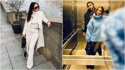 Malaika also showed off her steal-worthy holiday wardrobe in the photos. She rocks an all-white ensemble featuring a long coat, cropped high-neck jumper, high-waisted flared denim pants, a top handle bag, glasses and heels. The second picture shows her in a lift, dressed in a mini turtleneck sweater dress, sheer stockings and boots. (Instagram) Malaika also showed off her steal-worthy holiday wardrobe in the photos. She rocks an all-white ensemble featuring a long coat, cropped high-neck jumper, high-waisted flared denim pants, a top handle bag, glasses and heels. The second picture shows her in a lift, dressed in a mini turtleneck sweater dress, sheer stockings and boots. (Instagram)