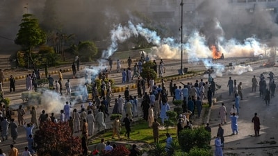 Police fire teargas shell towards Pakistan Tehreek-e-Insaf party activists and supporters of former Pakistan's Prime Minister Imran to dispers them during a protest against the arrest of their leader in Peshawar on Tuesday (AFP) Police fire teargas shell towards Pakistan Tehreek-e-Insaf party activists and supporters of former Pakistan's Prime Minister Imran to dispers them during a protest against the arrest of their leader in Peshawar on Tuesday (AFP)
