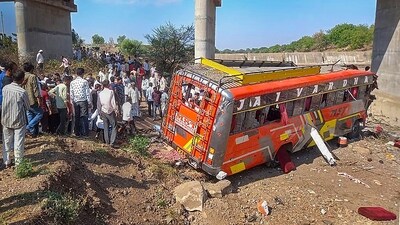 Khargone: Locals gather at the site after a bus fell from a bridge in Madhya Pradesh's Khargone district, Tuesday, May 9, 2023. At least 15 people were killed and 25 others injured in the accident, according to officials. (PTI)