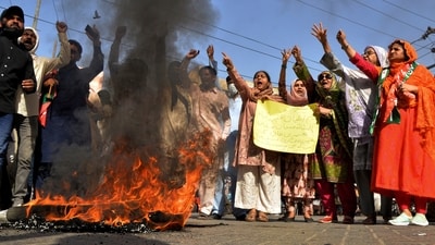 Imran Khan supporters chant slogans next to burning tires during a protest to condemn the arrest of their leader, in Hyderabad, Pakistan. (AP) Imran Khan supporters chant slogans next to burning tires during a protest to condemn the arrest of their leader, in Hyderabad, Pakistan. (AP)