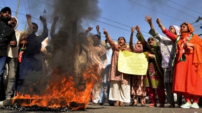 Imran Khan supporters chant slogans next to burning tires during a protest to condemn the arrest of their leader, in Hyderabad, Pakistan. (AP) Imran Khan supporters chant slogans next to burning tires during a protest to condemn the arrest of their leader, in Hyderabad, Pakistan. (AP)