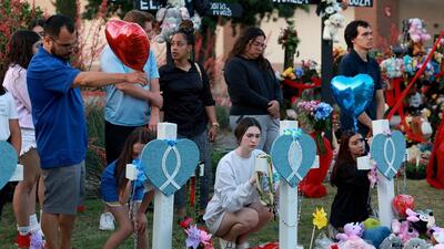 People write messages on crosses in a memorial setup near an entrance to the Allen Premium Outlets mall in Allen, Texas, on Monday. On May 6, a shooter opened fire at the outlet mall, killing eight people. (AFP) People write messages on crosses in a memorial setup near an entrance to the Allen Premium Outlets mall in Allen, Texas, on Monday. On May 6, a shooter opened fire at the outlet mall, killing eight people. (AFP)