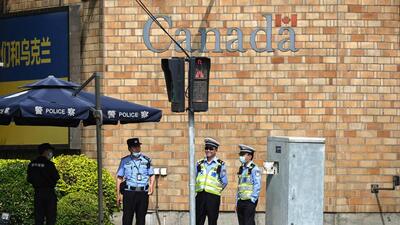 Police and traffic police stand outside the Canadian embassy in Beijing, on Tuesday. China said Canada has ‘sabotaged’ relations between the two nations by expelling a Chinese diplomat Ottawa has accused of seeking to intimidate a lawmaker critical of Beijing. (AFP) Police and traffic police stand outside the Canadian embassy in Beijing, on Tuesday. China said Canada has ‘sabotaged’ relations between the two nations by expelling a Chinese diplomat Ottawa has accused of seeking to intimidate a lawmaker critical of Beijing. (AFP)