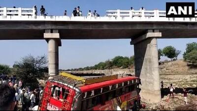 The bus fell on a dry river bed after hitting with the railings of a bridge. (ANI) The bus fell on a dry river bed after hitting with the railings of a bridge. (ANI)
