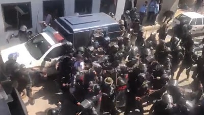 Ex-Pak PM Imran Khan being taken away by a horde of security personnel outside the Islamabad High Court. (Source: PTI/Twitter) Ex-Pak PM Imran Khan being taken away by a horde of security personnel outside the Islamabad High Court. (Source: PTI/Twitter)