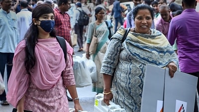 Polling officials leave for their respective polling booths after collecting EVMs and other voting materials ahead of the Karnataka Assembly elections, in Hubballi. (PTI) Polling officials leave for their respective polling booths after collecting EVMs and other voting materials ahead of the Karnataka Assembly elections, in Hubballi. (PTI)