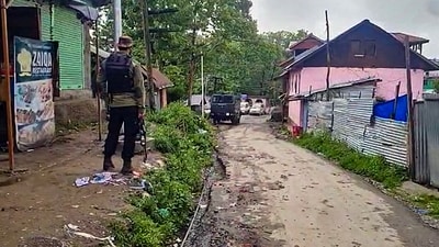 Anantnag: Security personnel stands guard outside a property during a search by officials of the National Investigation Agency (NIA), at Srigufwara village in Anantnag district, Tuesday, May 9, 2023. (PTI) Anantnag: Security personnel stands guard outside a property during a search by officials of the National Investigation Agency (NIA), at Srigufwara village in Anantnag district, Tuesday, May 9, 2023. (PTI)