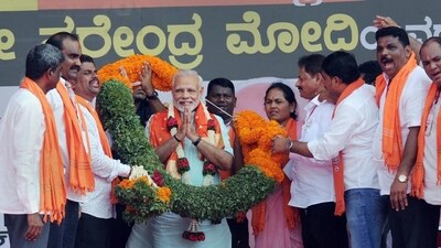 Prime Minister Narendra Modi being garlanded by BJP workers at an election campaign rally. (PTI) Prime Minister Narendra Modi being garlanded by BJP workers at an election campaign rally. (PTI)