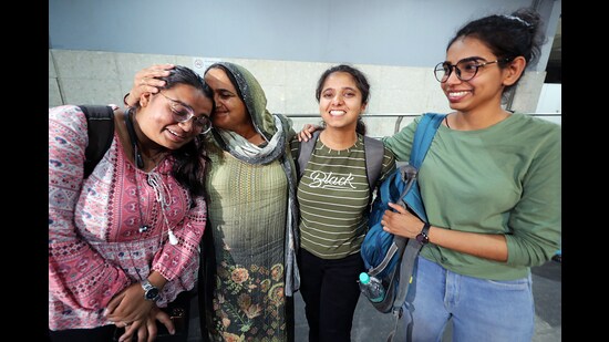 Haryana students meet their family members after returning from the violence-hit Manipur at Indira Gandhi International (IGI) Airport in New Delhi on Monday. (ANI)
