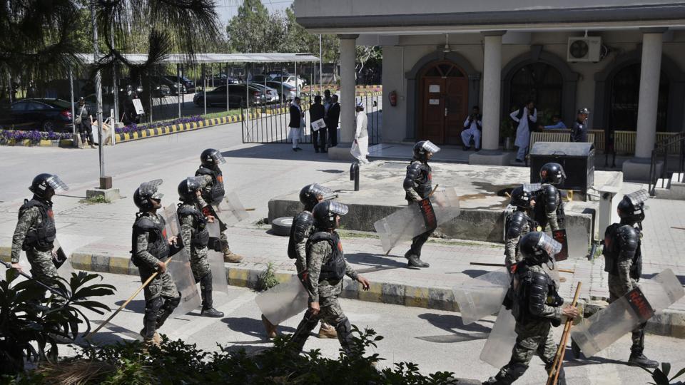 Pakistani paramilitary troops walks in a court, where Pakistan’s former Prime Minister Imran Khan was to appear, in Islamabad. He was later arrested (AP) Pakistani paramilitary troops walks in a court, where Pakistan’s former Prime Minister Imran Khan was to appear, in Islamabad. He was later arrested (AP)