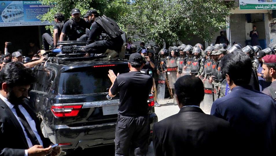 Pakistan security forces guard a vehicle carrying former Prime Minister Imran Khan after his arrest at a court in Islamabad (Reuters) Pakistan security forces guard a vehicle carrying former Prime Minister Imran Khan after his arrest at a court in Islamabad (Reuters)