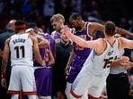  Phoenix Suns forward Kevin Durant (35) pushes Denver Nuggets center Nikola Jokic (15) in the third quarter during game five of the 2023 NBA playoffs at Ball Arena. 