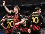 Manchester City's Belgian midfielder Kevin De Bruyne (L) celebrates scoring his team's first goal during the UEFA Champions League semi-final first leg football match between Real Madrid CF and Manchester City at the Santiago Bernabeu stadium Manchester City's Belgian midfielder Kevin De Bruyne (L) celebrates scoring his team's first goal during the UEFA Champions League semi-final first leg football match between Real Madrid CF and Manchester City at the Santiago Bernabeu stadium