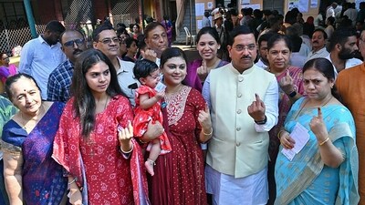 Union Minister for Parliamentary Affairs Pralhad Joshi and his family members show their ink-marked fingers after casting their vote for the Karnataka Assembly elections, at Vivekananda Nagar Rotary School, Nagashettikoppa, in Hubbali. (ANI) Union Minister for Parliamentary Affairs Pralhad Joshi and his family members show their ink-marked fingers after casting their vote for the Karnataka Assembly elections, at Vivekananda Nagar Rotary School, Nagashettikoppa, in Hubbali. (ANI)