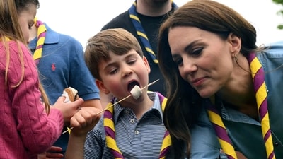 Britain's Prince Louis eats toasted marshmallows as they take part in the Big Help Out, during a visit to the 3rd Upton Scouts Hut in Slough, England. (AP) Britain's Prince Louis eats toasted marshmallows as they take part in the Big Help Out, during a visit to the 3rd Upton Scouts Hut in Slough, England. (AP)