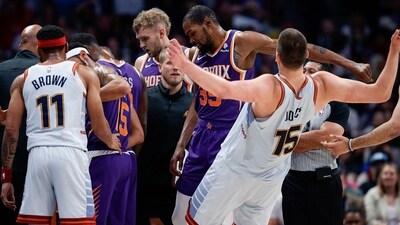 Phoenix Suns forward Kevin Durant (35) pushes Denver Nuggets center Nikola Jokic (15) in the third quarter during game five of the 2023 NBA playoffs at Ball Arena. (USA TODAY Sports via Reuters Con)