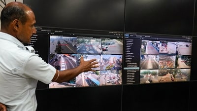 A Kolkata Police personnel monitors vulnerable locations and river banks through CCTV footage in preparation for the landfall of Cyclone 'Mocha', at an integrated control room at Police Headquarters Lalbazar, in Kolkata. (PTI) A Kolkata Police personnel monitors vulnerable locations and river banks through CCTV footage in preparation for the landfall of Cyclone 'Mocha', at an integrated control room at Police Headquarters Lalbazar, in Kolkata. (PTI)