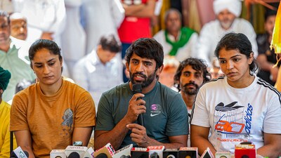 Wrestlers Bajrang Punia, Vinesh Phogat and Sakshi Malik address the media during their ongoing protest (PTI) Wrestlers Bajrang Punia, Vinesh Phogat and Sakshi Malik address the media during their ongoing protest (PTI)