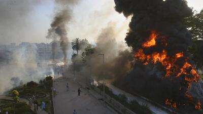 Protests erupted in several cities of Pakistan after the arrest of former premier Imran Khan on corruption charges. (AP) Protests erupted in several cities of Pakistan after the arrest of former premier Imran Khan on corruption charges. (AP)