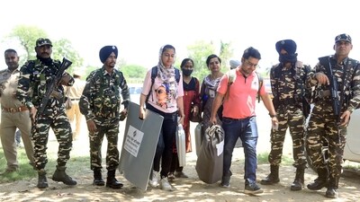 Paramilitary and police personnel escort polling officials as they leave for their respective polling booths after collecting EVMs and other voting materials on the eve of Jalandhar by-elections, in Jalandhar on Tuesday. (ANI) Paramilitary and police personnel escort polling officials as they leave for their respective polling booths after collecting EVMs and other voting materials on the eve of Jalandhar by-elections, in Jalandhar on Tuesday. (ANI)