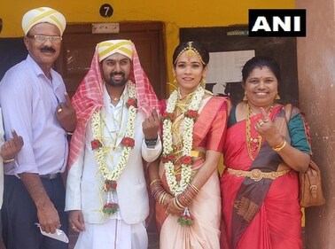 Bride and groom along with their family cast their votes for Karnataka Assembly Election 2023 at a polling booth in Mysuru. (ANI) Bride and groom along with their family cast their votes for Karnataka Assembly Election 2023 at a polling booth in Mysuru. (ANI)