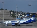 A Go First airline aircraft, formerly known as GoAir, is seen parked at the apron of the Mumbai International airport on May 3, 2023.
