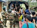 Security personnel during a rescue operation in Manipur on Sunday. (ANI)