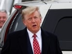 FILE PHOTO: Former U.S. President and Republican presidential candidate Donald Trump reacts after arriving at Aberdeen International Airport 
