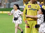 Ziva Dhoni with MS Dhoni.